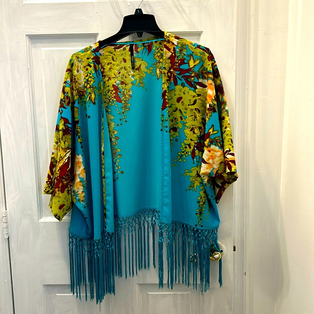 Fringed short, duster or cover-up.